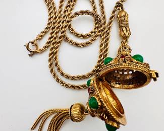 A vintage signed Florenza perfume pomander / hinged locket tassel pendant necklace, decorated with deep green cabochons and multi colored rhinestones