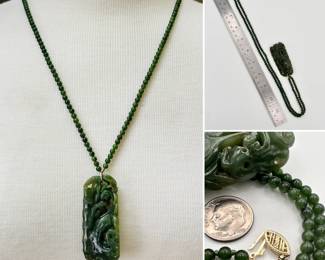 A gorgeous beaded jade and carved pendant necklace with 14k yellow gold clasp, the pendant carved to show a phoenix bird amidst bamboo 