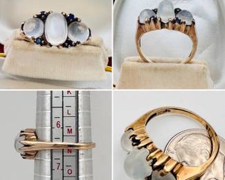 An antique ring set with three moonstone cabochons with sapphire accents in 10-karat yellow gold.