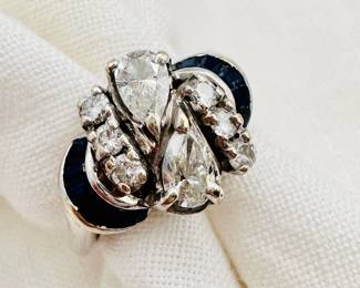 Closeup of the platinum diamond and sapphire ring in original C.D. Peacock Chicago presentation box