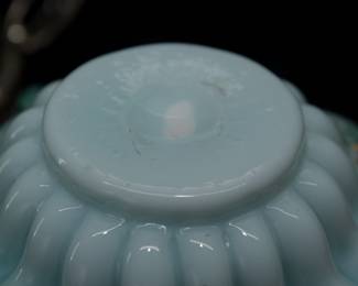 Closeup of 19th century ruffled art glass bowl bride's basket with silver plated basket handle stand