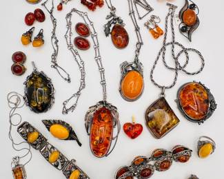 A view of some of the amber pendant necklaces, amber bracelets, amber and silver brooches available