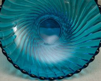 Close up of vintage Baccarat Deposé blue crystal glass swirl footed bowl