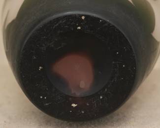 Closeup of the signed Arsall cameo glass vase circa 1900, a graceful Art Nouveau design of budding and blooming flowers, sprouting and fallen leaves. Signed in cameo relief on a dark leaf lower side area, and has a model number hand etched on the underside near the polished pontil.