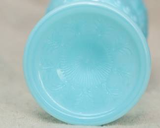 Closeup of the base of the set of 6 Portieux Vallerysthal opaque blue patterned glass goblets. 