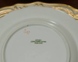 Closeup of the Spode Copeland's China service for six in fine ivory cream color bone china with gilt scrollwork edges 