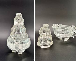 Another view of the Chinese carved rock crystal censer and cover, early 20th century, of compressed globular form, resting on three short paw-shaped feet, the lid surmounted with a seated mythical beast, shoulders are flanked by mythical beast mask handles. Both the lid and body are carved with taotie mask designs.