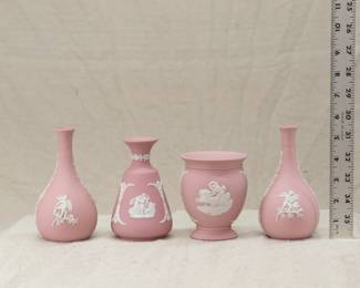 A group of Wedgewood cream on pink jasper ware vases