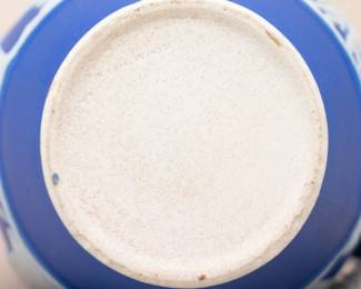 Closeup of the very nice Wedgwood early to mid-1800s blue dip jasper ware small pitcher or creamer skillfully sprigged with white classical mythology figures, impressed WEDGWOOD mark and indistinct potter's mark to the base.