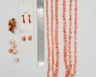 Carved coral bead necklaces, coral earrings, and a 14k yellow gold and coral bead brooch
