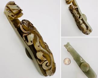A Chinese carved jade "dragon" belt hook, carved with a scroll form chilong facing a dragon head terminal