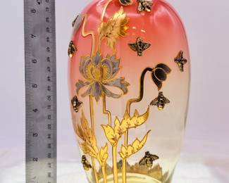 An exquisite Art Nouveau era vase shading from warm pink to clear, gilded with floral design and applied gold metal bees! Likely Bohemia glass from Moser.