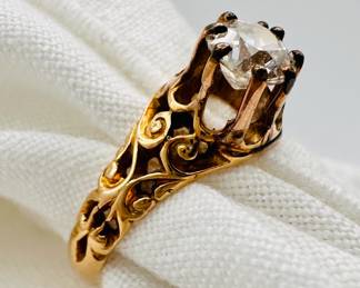 Closeup of the 18k yellow gold and diamond ring in original Marshall Field & Company box