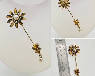 A charming vintage Miriam Haskell daisy form gold tone and faux pearl stickpin with original bottom flower and pearl clasp, unsigned.