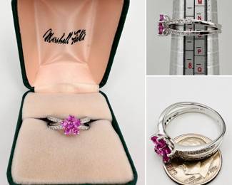 18k white gold split band ring, with pavé set diamonds in the bands and a central pink gemstone flower form 