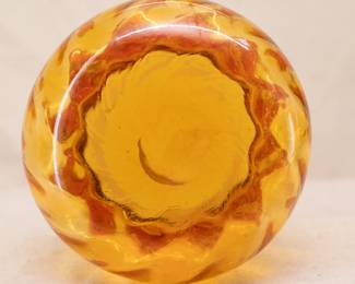Closeup of one of a pair of vintage and tall Amberina art glass vases, optical ribbing and ruffled crimped rims