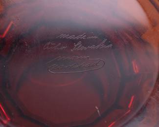 Closeup of the beautiful signed amber facet-cut glass Moser Karlsbad frieze vase, 11" high with an acid-etched “Oroplastic” gold-gilt frieze of Amazon warriors and Greek soldiers. The underside signed in script, ‘Moser, Carlsbad, made in Czechoslovakia’. Circa 1925.