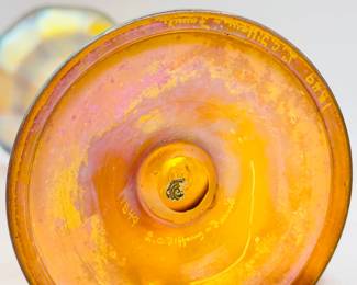Closeup of base of the signed Louis Comfort Tiffany favrile art glass flower vase, gold iridescent favrile glass, footed, ribbed cylindrical form with cupped mouth and wavy rim, signed in etch on base '1549' and "L. C. Tiffany - Favrile' for Tiffany Studios, first quarter 20th century; 13-1/2 inches high