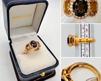18k yellow gold ring with a central smoky quartz flanked by two citrines, each stone encircled by diamonds
