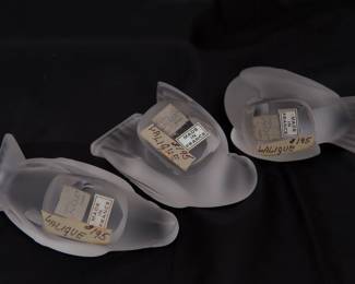 Another view of the trio of Lalique France frosted crystal sparrow figurines in different postures. Please note this photo includes old price tags from when our client originally purchased the pieces, and does not reflect the current sale price.