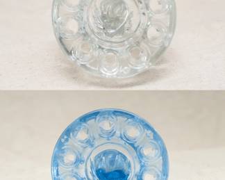 Another view of the pair of smaller vintage flower frogs in clear and blue glass