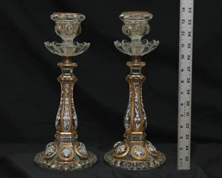 A pair of antique French Baccarat crystal medallion pattern white enameled and gilded candlestick holders