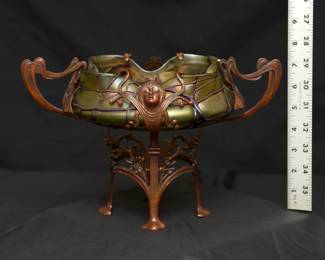 A fabulous Art Nouveau era centerpiece of an iridescent art glass bowl (possibly Loetz) with sculpted bronzed metal stand.