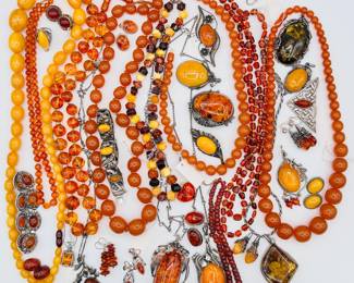 Some of the incredible amber jewelry available at this Evanston estate sale! Amber beaded necklaces, amber bracelets, amber earrings – and several sweet amber brooches for a flash of autumn color. 