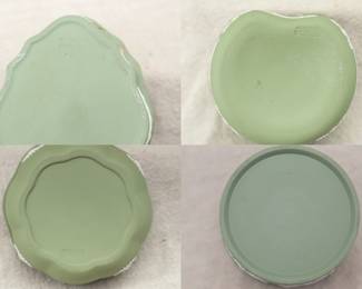 View of the bases of the four Wedgwood sage green jasper ware lidded boxes
