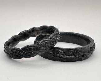 Another view of the two black jade carved bangle bracelets