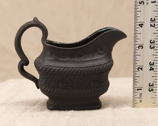 A Wedgwood black basalt 'strawberries' creamer, with a sprig band of fruiting strawberry plants around the body, and fruiting grapevines beneath the rim