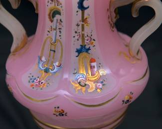 Closeup of the large Bohemian cut opaque-glass four-handled vase, late 19th century. Likely made for the Persian market. Applied with four loop handles, the opaque glass with pink stain; enameled and gilt with flowers, scrolls, buildings and trailing fruiting vines.