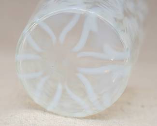 Closeup of Northwood Spanish Lace white opalescent glass water pitcher with six matching tumblers 