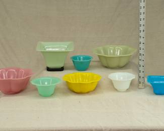 Peking Glass bowls and cache pots in a variety of colors, several have the word "CHINA' hand etched on the base.