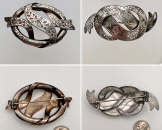 Antique Scottish jewelry – silver brooches, each with a curving engraved ribbon design.