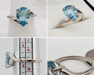 A white gold and pear shape aquamarine ring set in 14-karat white gold.