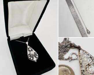Platinum and old European cut diamond pendant circa 1910 on a 14k gold white gold necklace chain