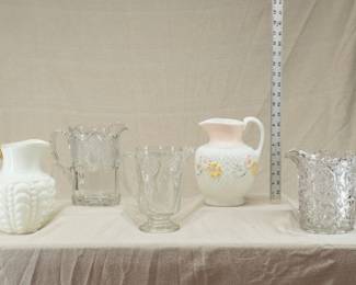 Antique American Art Glass Water Pitchers including a large Consolidated Lamp & Glass Co Guttate pattern milk glass water pitcher with gold trim, circa 1894-1900; a McKee & Brothers Jubilee pattern pitcher late 1890's, a large 9-inch Consolidated Glass Co Cosmos pattern milk glass pitcher 1894-1915