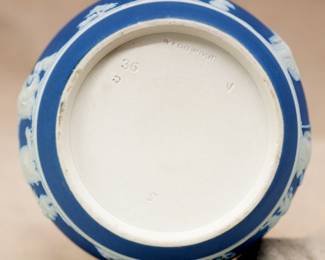 Closeup of the small, Wedgwood, blue jasper dip pitcher or creamer, decorated with classical Grecian figures and swag ornamentation