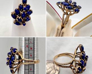 A 1960's cocktail style cluster ring set with pear-shape cabochon lapis lazuli in a textured 14-karat yellow gold setting.