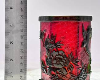 A vintage Chinese Peking Glass brush pot or bitong, hexagonal form, featuring dark green over red cameo glass carved in a birds and flowering peony design