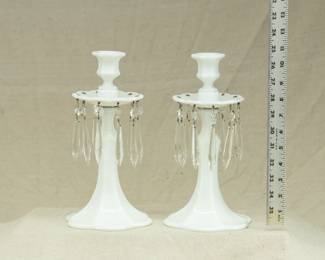 White milk glass candlesticks with bobeche and prisms