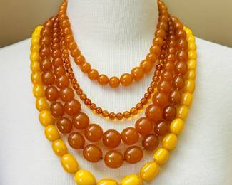 Multiple necklaces of strung amber beads ranging in size from small to chonky! Beautiful shades of honey.