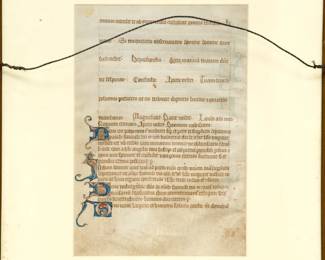 The reverse side of the framed page from a East Anglian Latin Psalter (27.5 cm x 17.5 cm overall, 19 cm x 12.7 cm justified) written in brown ink in a neat, clear quadratus Gothic bookhand in 30 single-columned lines per page on vellum. It was produced in Suffolk, perhaps at Bury-St. Edumunds, ca. 1290-1310.