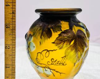 A signed Emile Gallé cameo glass vase, yellow with greenish brown leaves and white fruit on vines. Circa 1908-1920.