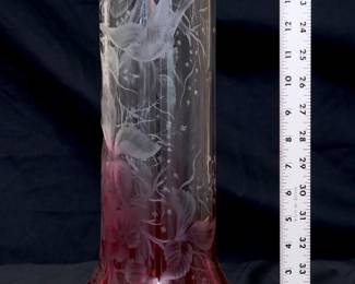 An incredible 15-inch tall art glass vase shading from clear to cranberry, beautifully wheel cut or engraved with detailed scene of birds in flight amidst flowering branches and vines. Possibly Moser Glass.