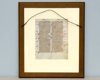 Reverse view of the framed leaf from a Bible produced in the manner of William de Brailles workshop, Oxford, circa 1230-1240. Hebrews leaf with fine gold initials and herringbone feathers emerging from the mouth of dragons.