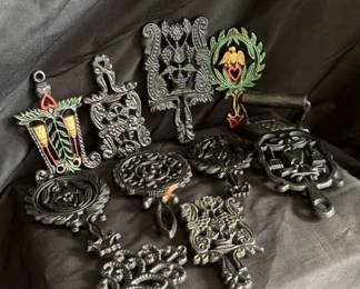 Collection Of Vintage Cast Iron Marked Trivets Including Dumb Dutch Grape And More