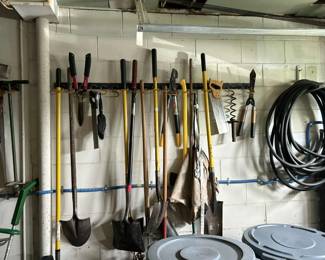 The garage is packed with seasonal decorations, pool and car care items, household cleaners, shovels, rakes, yard tools, and more—plenty of tools and great deals to dig into!