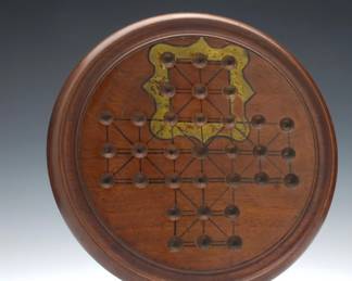 Antique Solitaire Board, Circa 1870
Antique decorated 19th century mahogany solitaire board with a surrounding well to store removed marbles when playing.